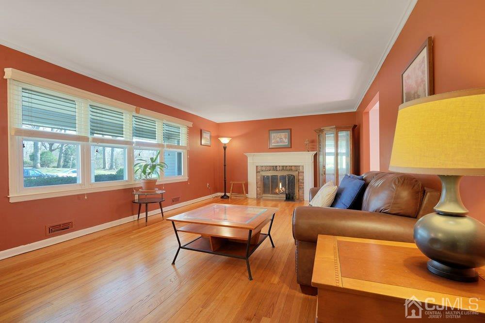 1 Wallace Road Middletown, NJ 07748 - Photo 5 of 28 a living room with furniture and a large window