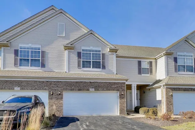 a front view of a house with parking