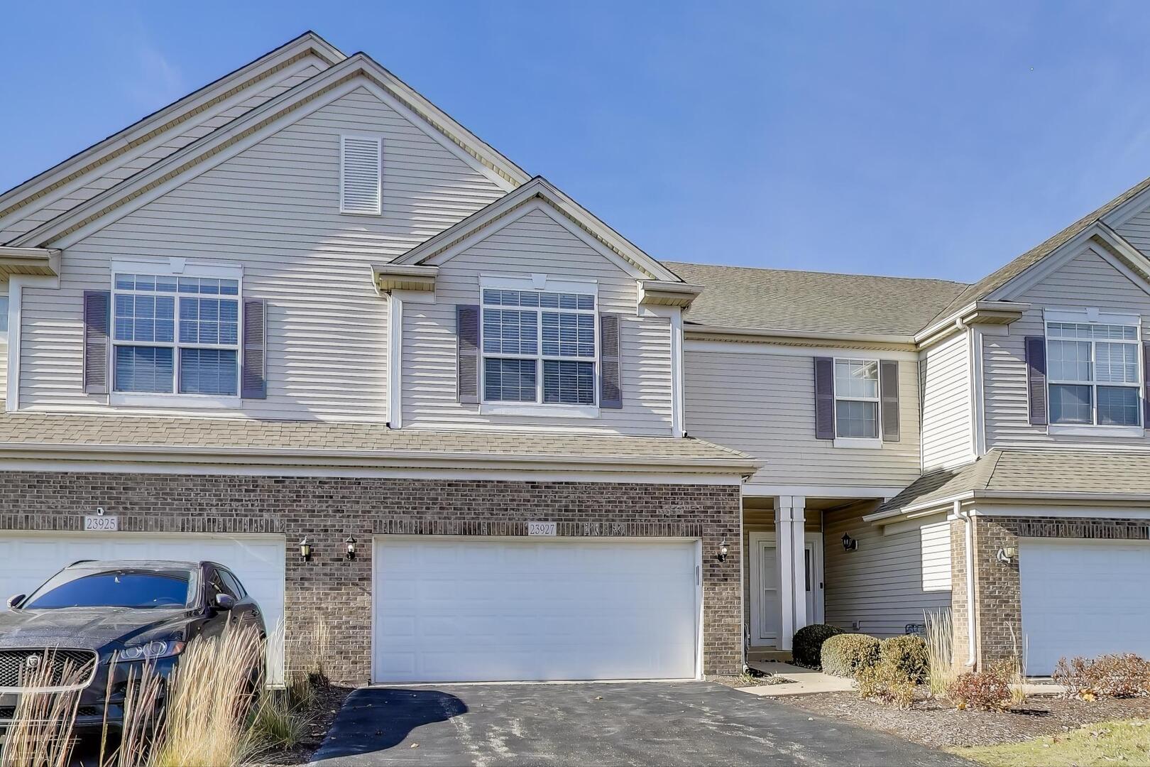 a front view of a house with parking