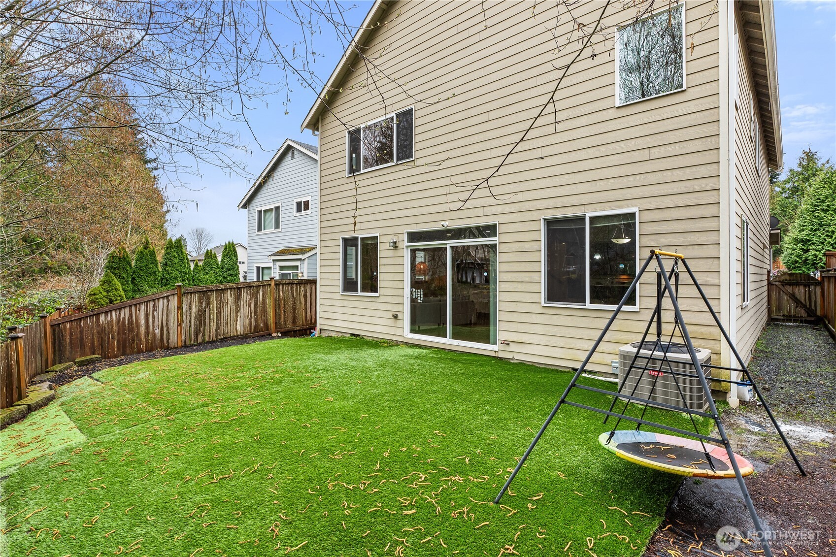 20304 3rd Drive Southeast Bothell, WA 98012 - Photo 30 of 31 a view of a backyard with plants and wooden fence