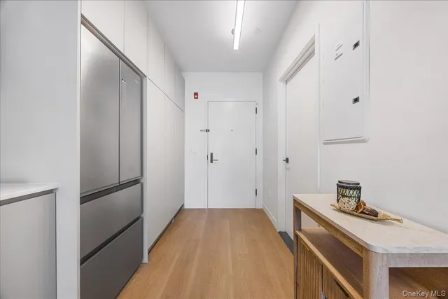 a view of a kitchen from the hallway
