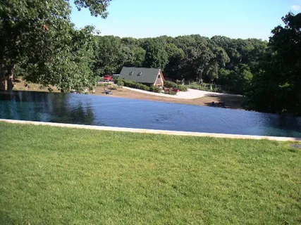 a view of a house with backyard and porch
