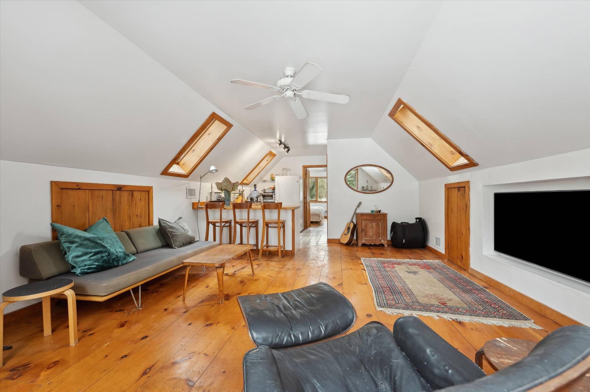 72 South Ferry Road Shelter Island, NY 11964 - Photo 20 of 26 a living room with furniture and a flat screen tv