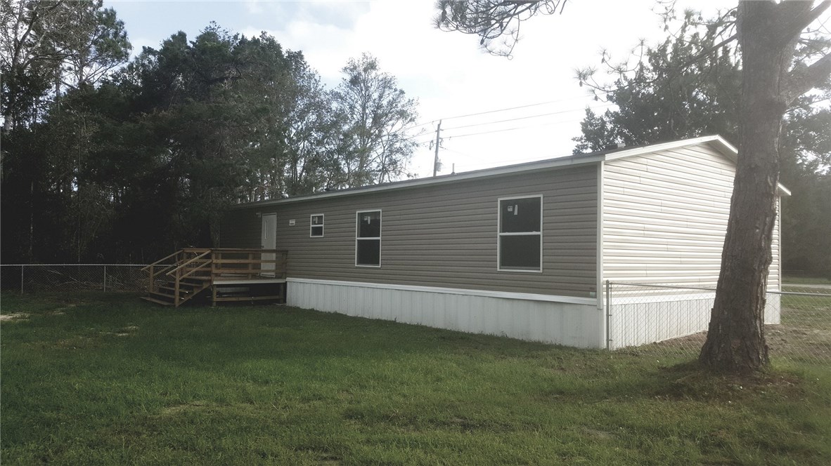 96311 Blackrock Road Yulee, FL 32097 - Photo 2 of 8 a view of a house with a yard