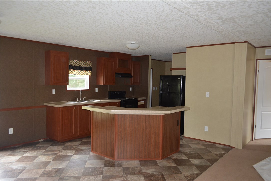96311 Blackrock Road Yulee, FL 32097 - Photo 3 of 8 a view of kitchen with stainless steel appliances granite countertop cabinets and a refrigerator
