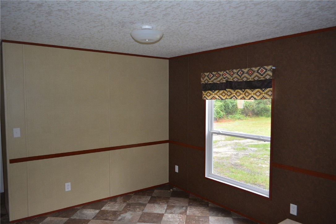 96311 Blackrock Road Yulee, FL 32097 - Photo 6 of 8 a view of an empty room with a window