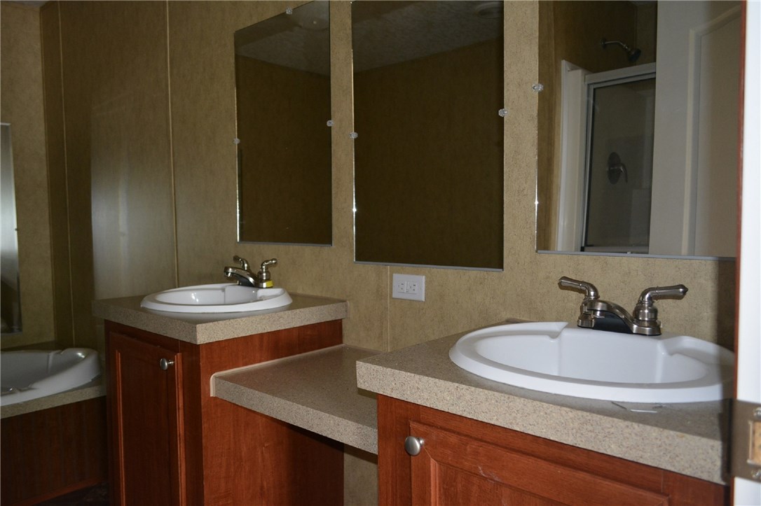 96311 Blackrock Road Yulee, FL 32097 - Photo 7 of 8 a bathroom with a sink and a mirror