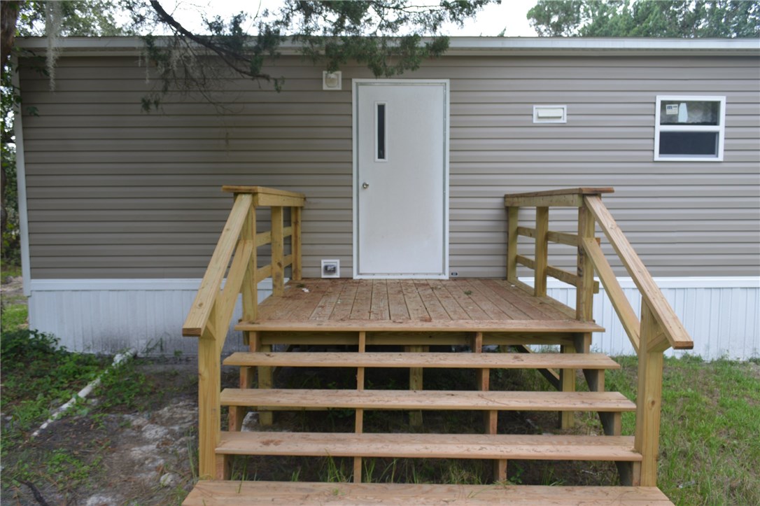 96311 Blackrock Road Yulee, FL 32097 - Photo 8 of 8 a front view of a house with a yard