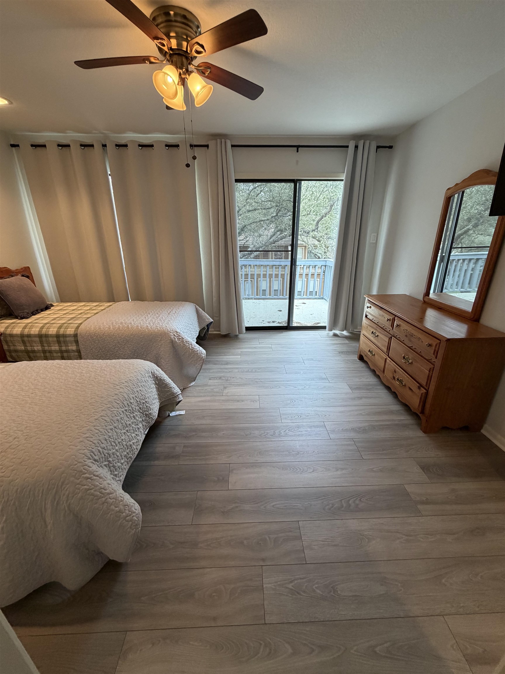 307 Crestview Horseshoe Bay, TX 78657 - Photo 12 of 24 a bed sitting in a room next to a window