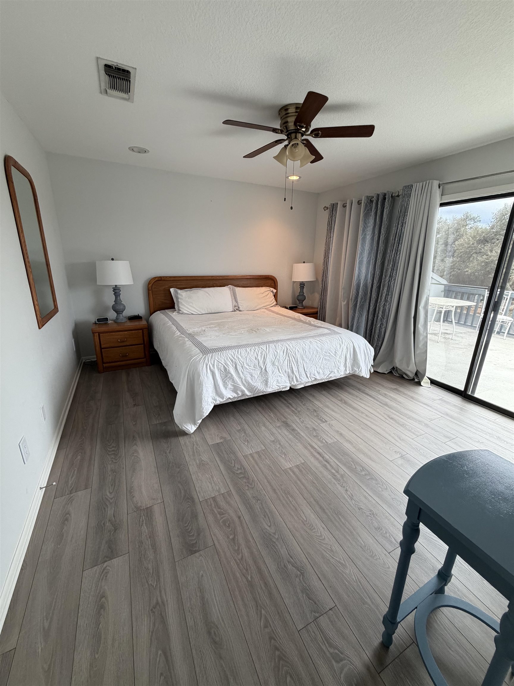 307 Crestview Horseshoe Bay, TX 78657 - Photo 16 of 24 a bedroom with a bed and wooden floor