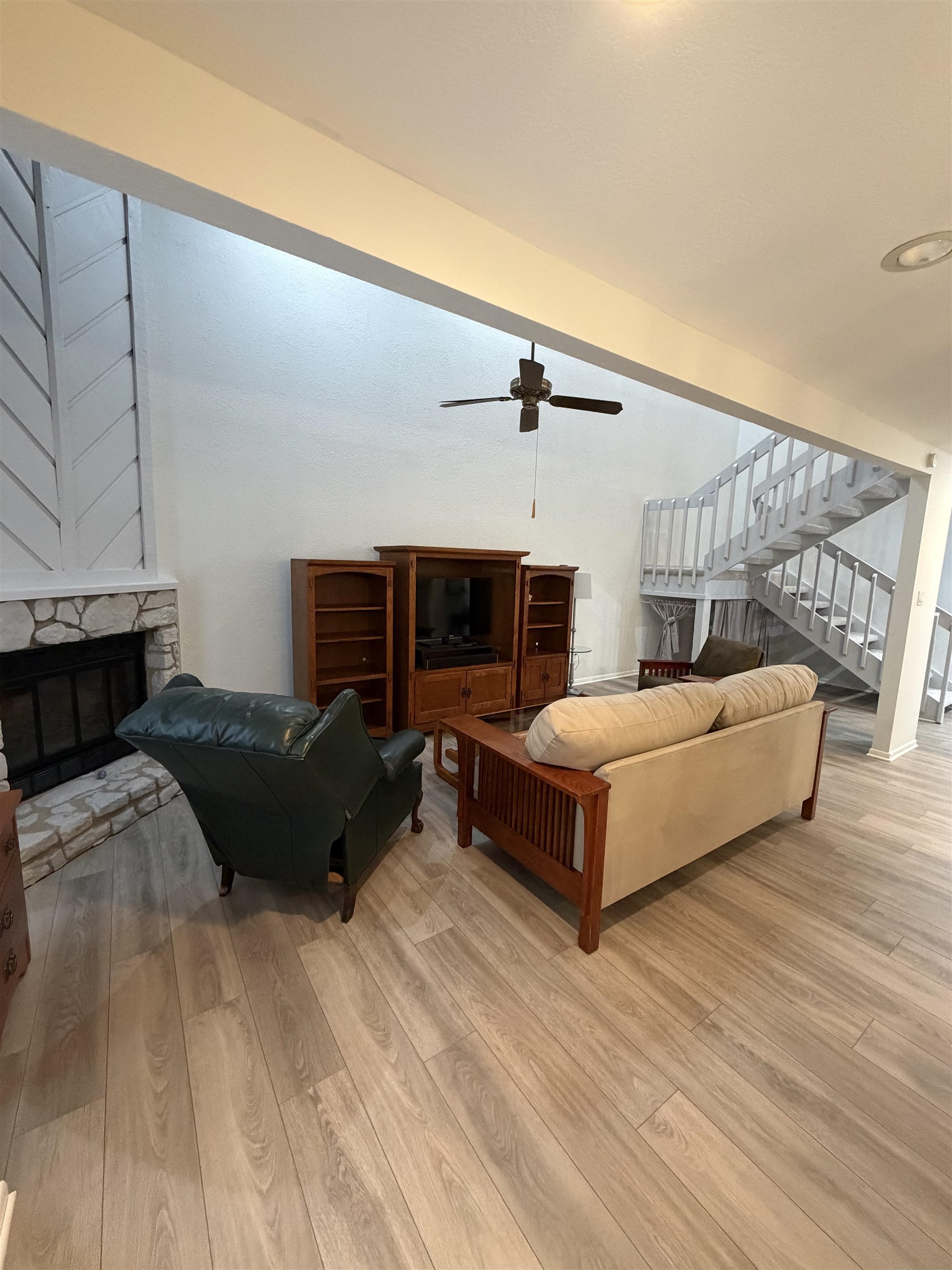 307 Crestview Horseshoe Bay, TX 78657 - Photo 7 of 24 a bedroom with a bed lamp and a fireplace