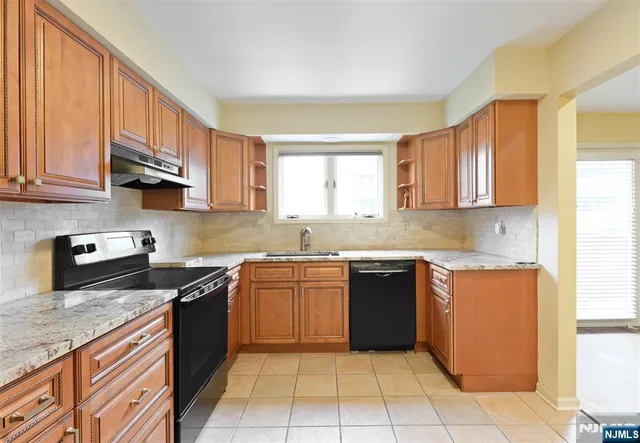 a view of a livingroom with furniture and an entryway