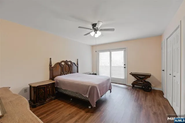 a bedroom with a bed and closet