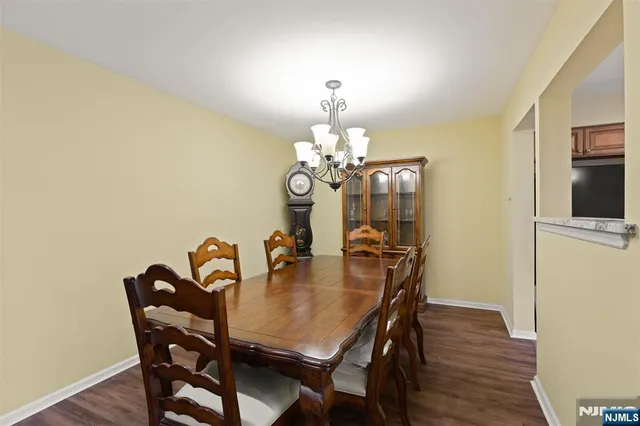 a dining room with furniture and chandelier