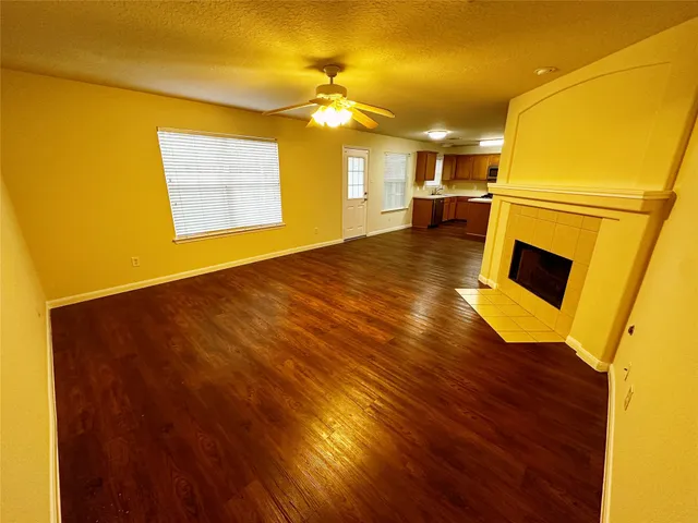 a view of a living room with a wooden floor