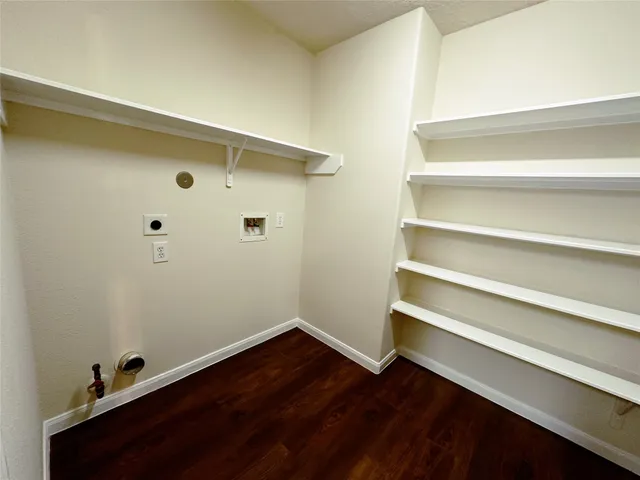 a view of room with wooden floor