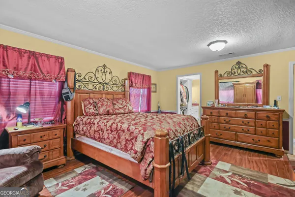a bedroom with a bed and furniture