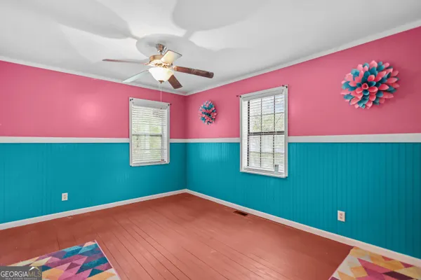 a room with window and a ceiling fan