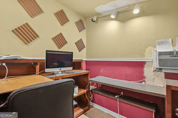 a bed room with a bed and a television