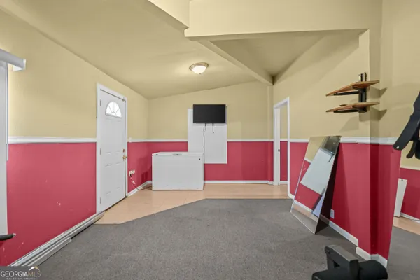 a view of a room with wooden walls