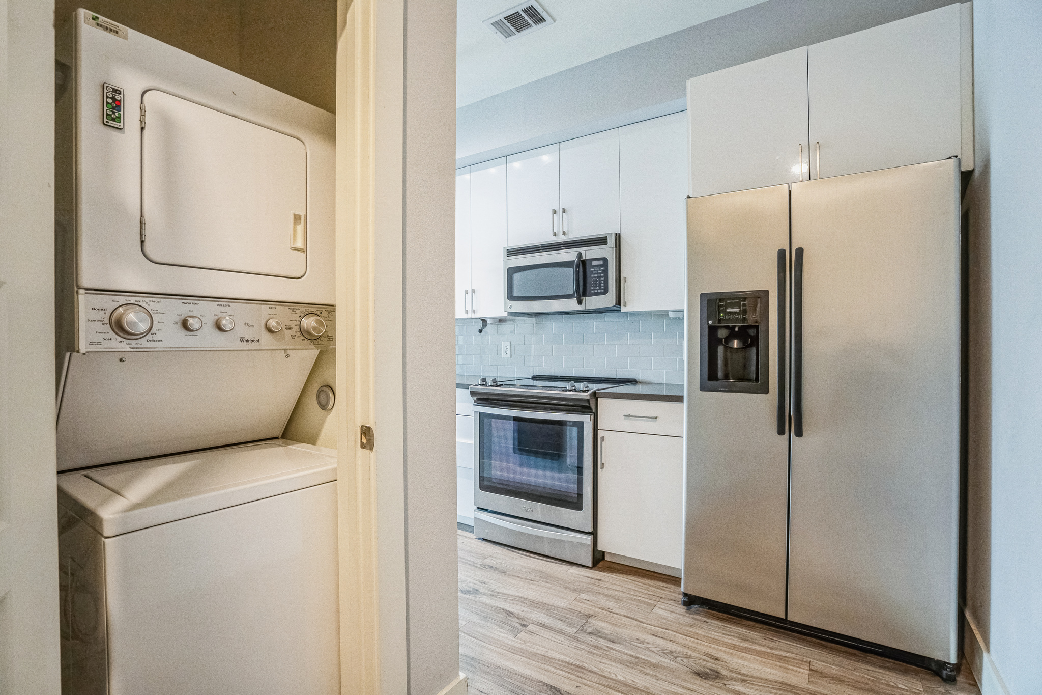 6444 Burnet Road, Unit 305 Austin, TX 78757 - Photo 10 of 13 a kitchen with stainless steel appliances a refrigerator sink and microwave