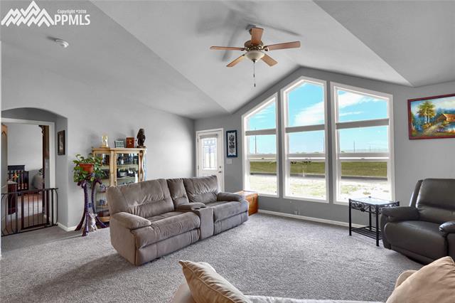 9990 North Log Road Calhan, CO 80808 - Photo 9 of 29 Huge picture window lets the natural light flow in and fill the space.