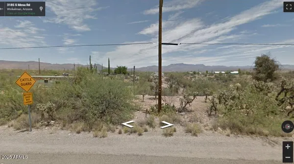 a view of a glass door and a yard