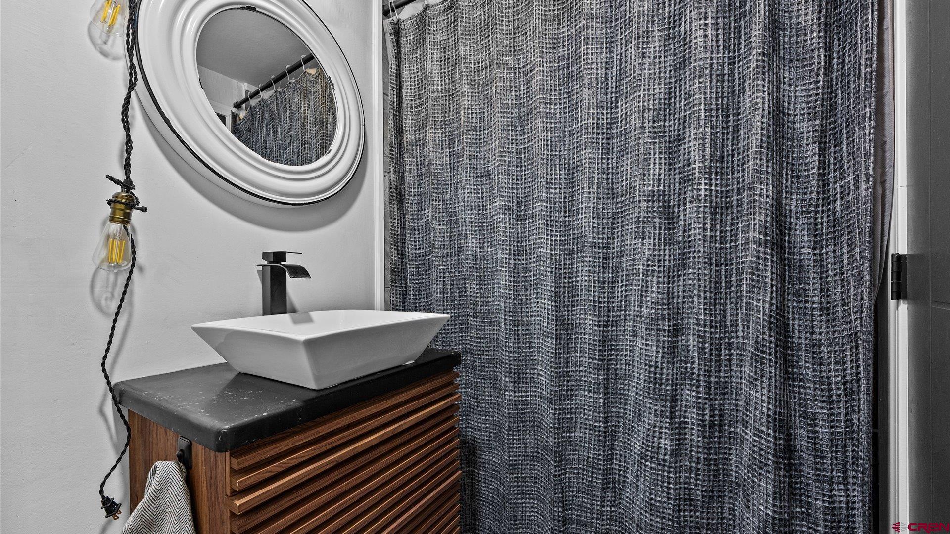 1761 G Road Delta, CO 81416 - Photo 17 of 43 a bathroom with a sink a toilet and a shower