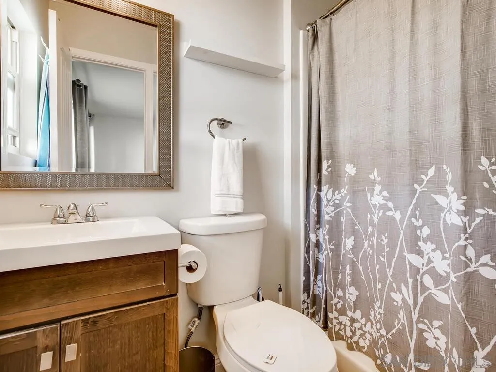 9559 Tuthill Way Santee, CA 92071 - Photo 15 of 27 a bathroom with a sink toilet and mirror