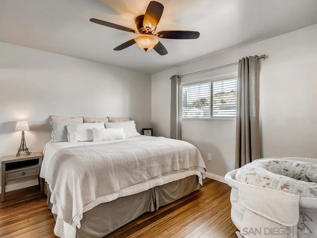 9559 Tuthill Way Santee, CA 92071 - Photo 19 of 27 a bedroom with a bed and a window