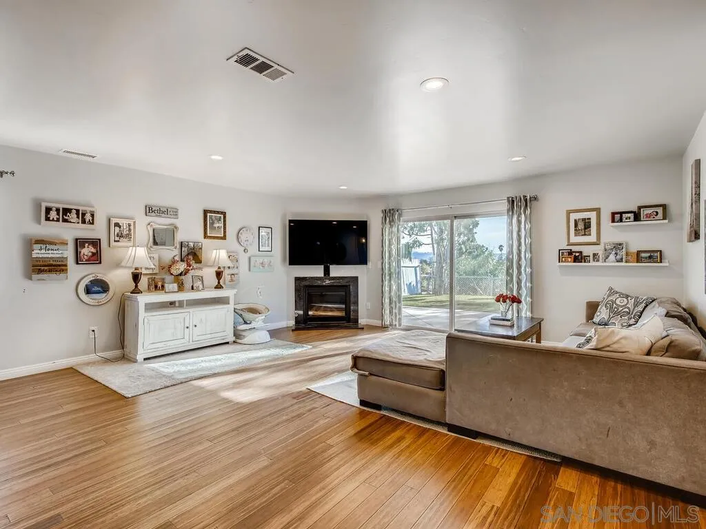 9559 Tuthill Way Santee, CA 92071 - Photo 25 of 27 a living room with furniture and a flat screen tv