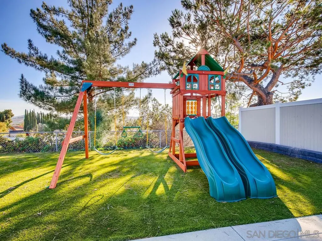 9559 Tuthill Way Santee, CA 92071 - Photo 7 of 27 a view of swimming pool with a backyard and a slide