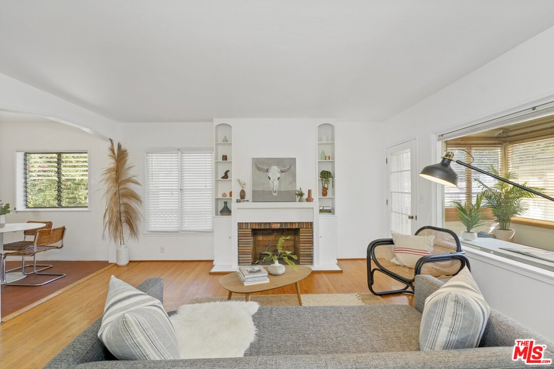 501 Sinclair Avenue Glendale, CA 91206 - Photo 2 of 20 a living room with furniture a fireplace and a large window