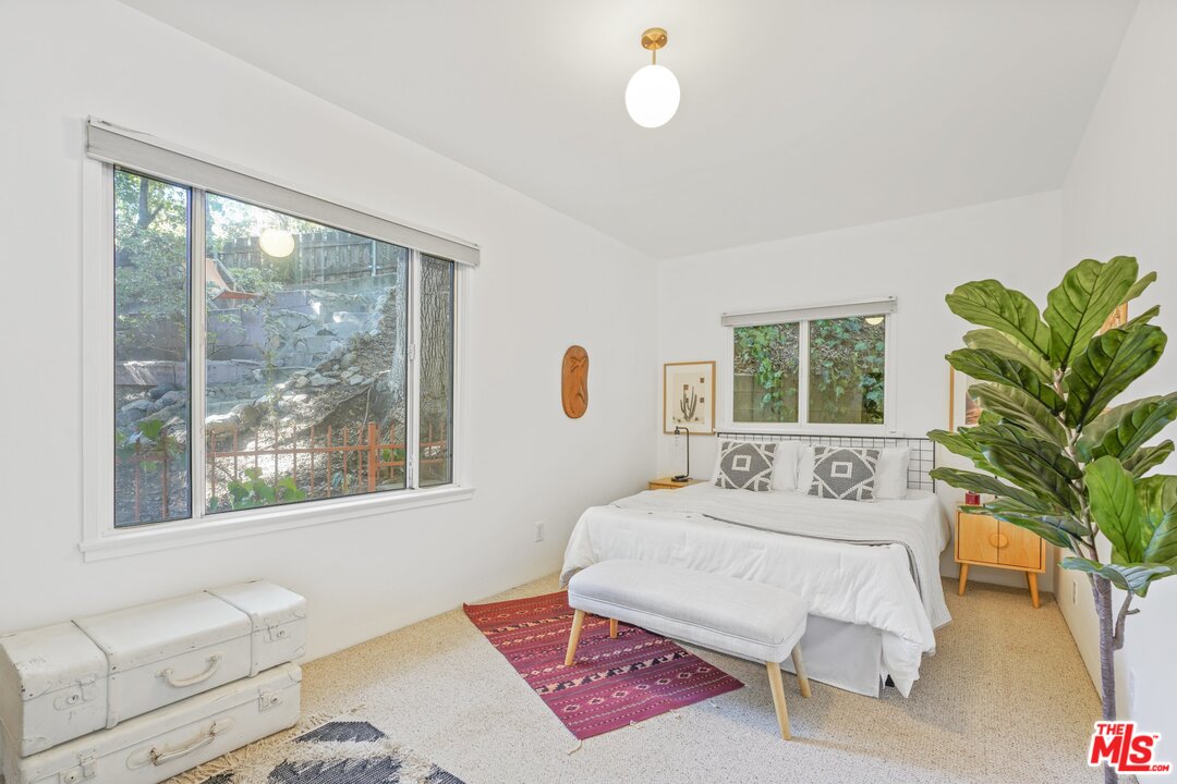 501 Sinclair Avenue Glendale, CA 91206 - Photo 13 of 20 a bedroom with a large bed and a large window with outer view