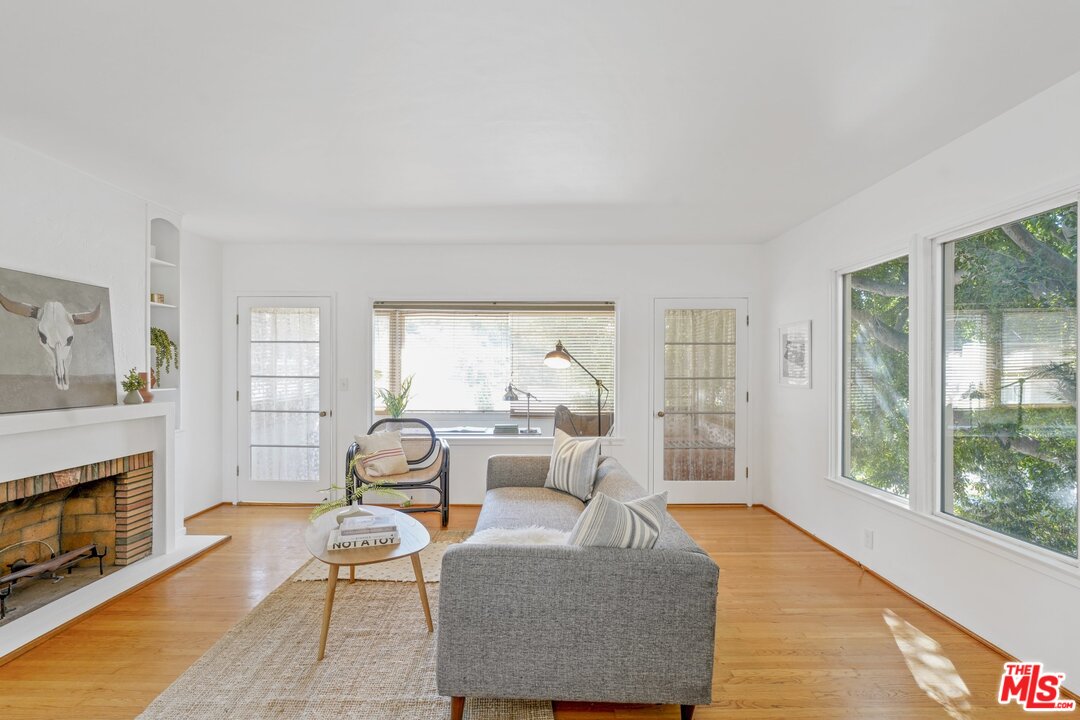 501 Sinclair Avenue Glendale, CA 91206 - Photo 4 of 20 a living room with furniture and a fireplace
