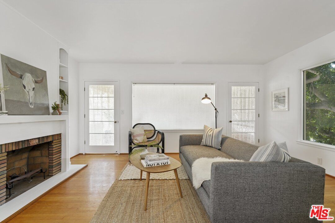 501 Sinclair Avenue Glendale, CA 91206 - Photo 7 of 20 a living room with furniture a window and a fireplace