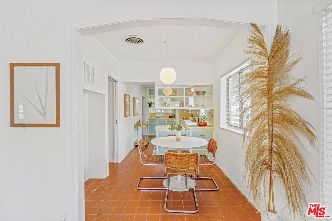 501 Sinclair Avenue Glendale, CA 91206 - Photo 9 of 20 a dining room with chandelier fan and wooden floor