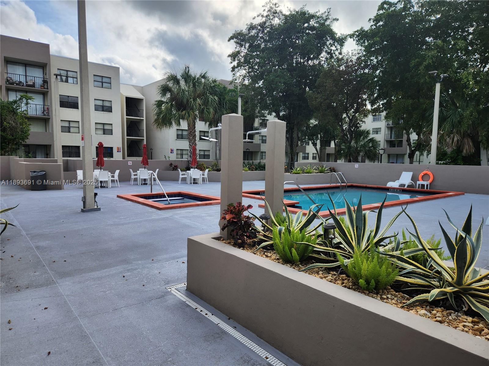 8000 Southwest 149th Avenue, Unit A107 Miami, FL 33193 - Photo 12 of 15 a view of a terrace with chairs