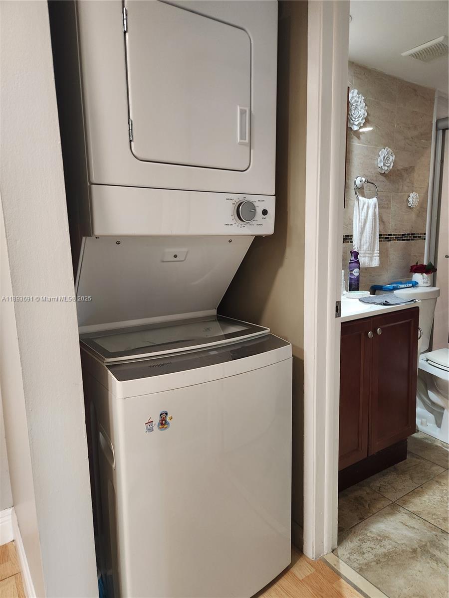 8000 Southwest 149th Avenue, Unit A107 Miami, FL 33193 - Photo 9 of 15 a utility room with dryer and washer