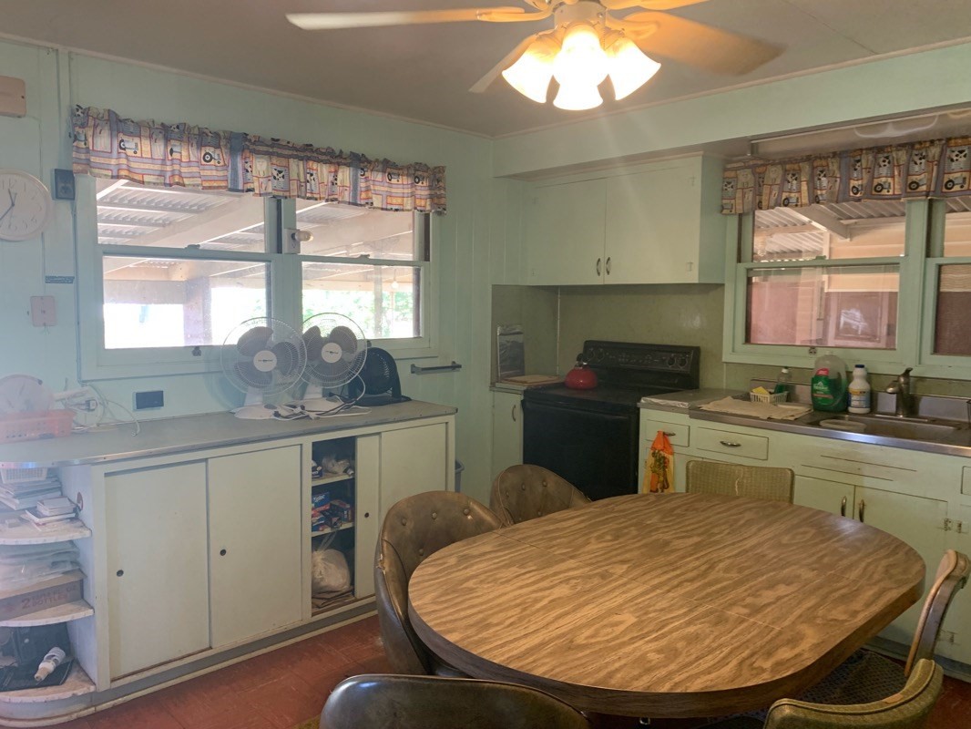 7975 Ulili Road Kekaha, HI 96752 - Photo 12 of 12 a kitchen with a stove a sink and a refrigerator