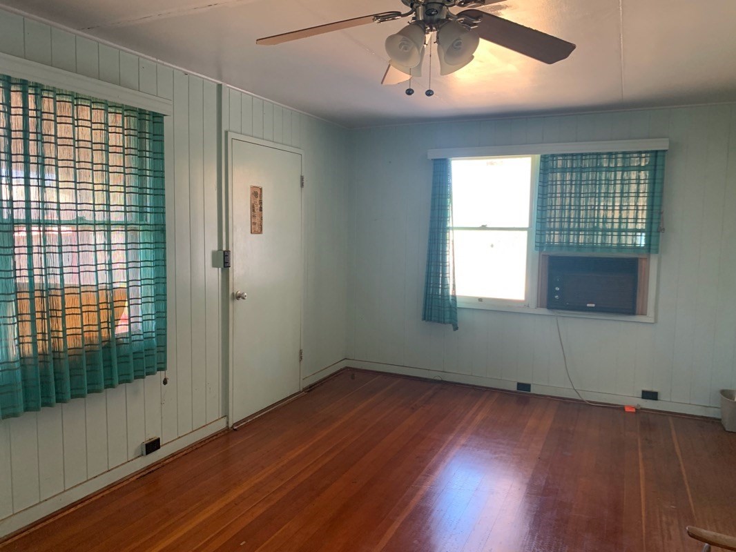 7975 Ulili Road Kekaha, HI 96752 - Photo 7 of 12 a view of empty room with wooden floor and fan