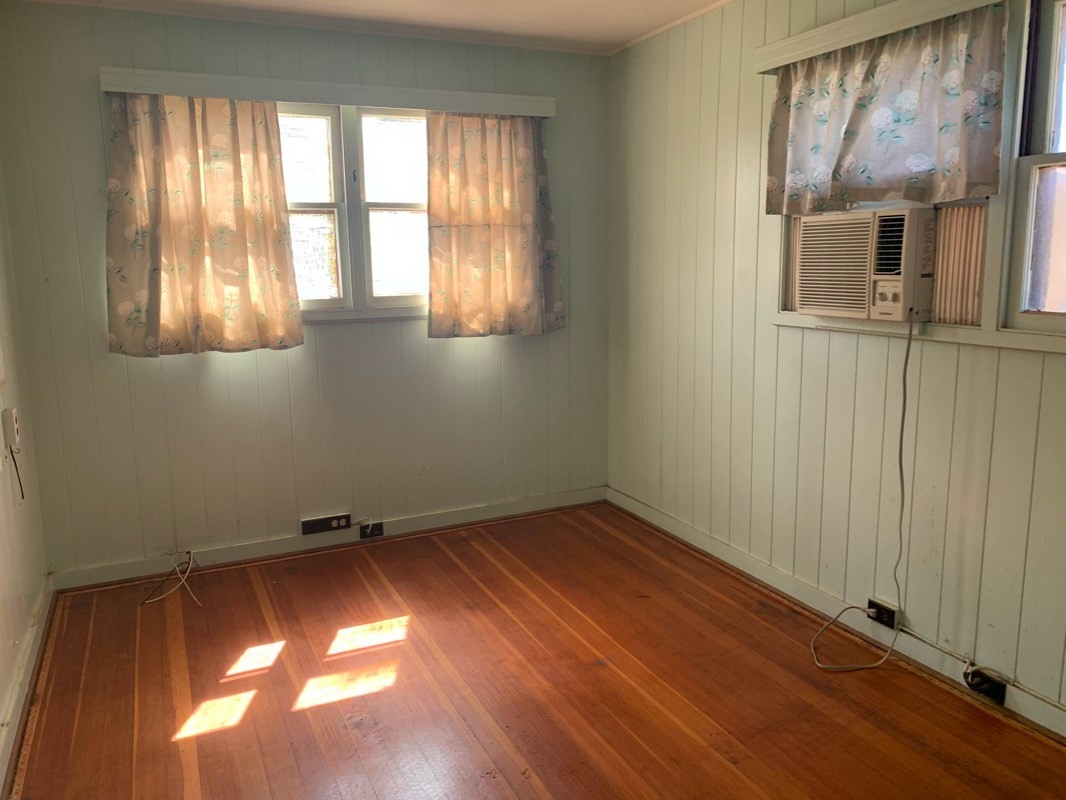 7975 Ulili Road Kekaha, HI 96752 - Photo 10 of 12 an empty room with a window
