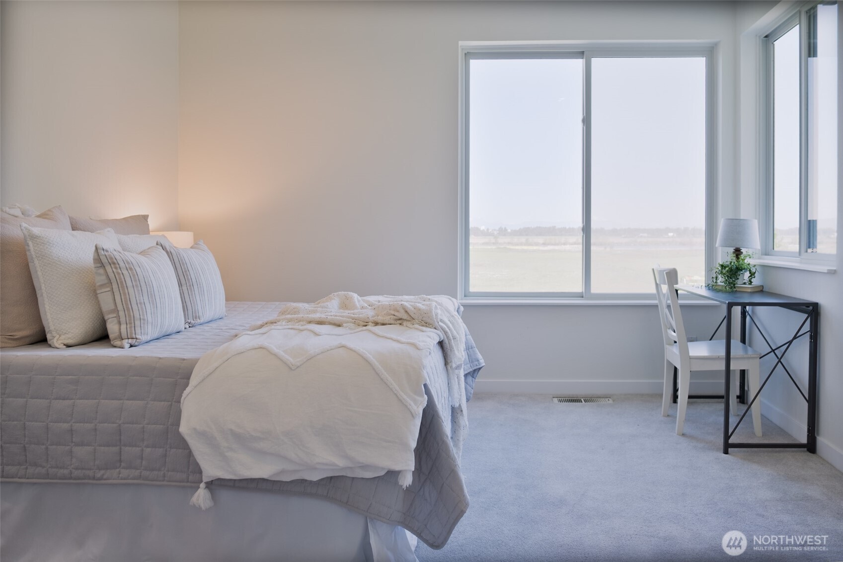 746 Van Dyk Road Lynden, WA 98264 - Photo 15 of 40 a bed sitting in a bedroom next to a window
