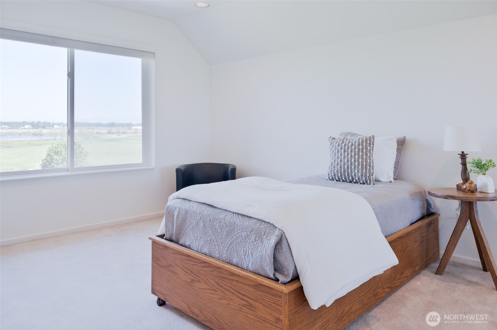 746 Van Dyk Road Lynden, WA 98264 - Photo 23 of 40 a bedroom with a bed and window