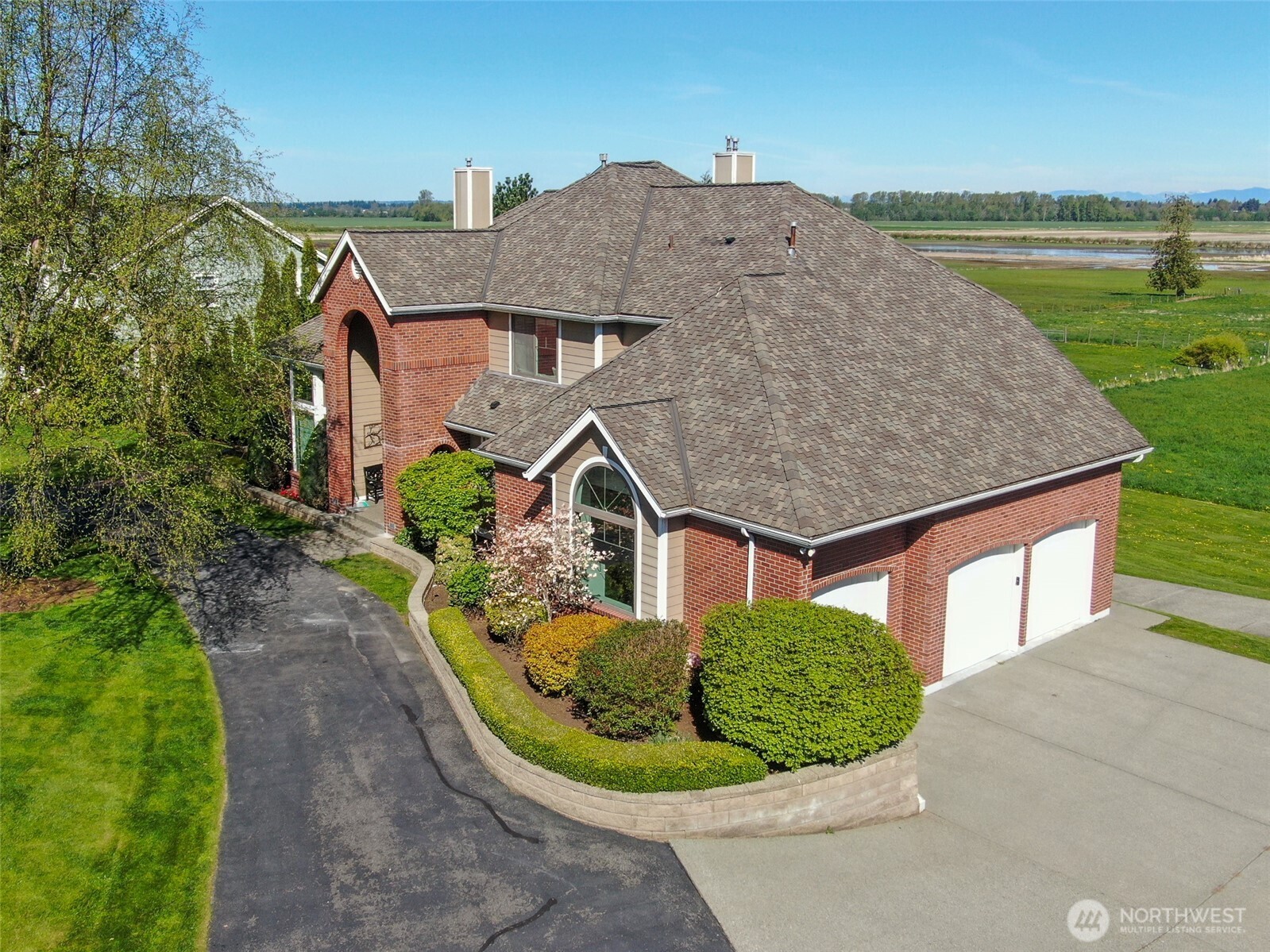 746 Van Dyk Road Lynden, WA 98264 - Photo 3 of 40 a aerial view of a house with a yard and potted plants