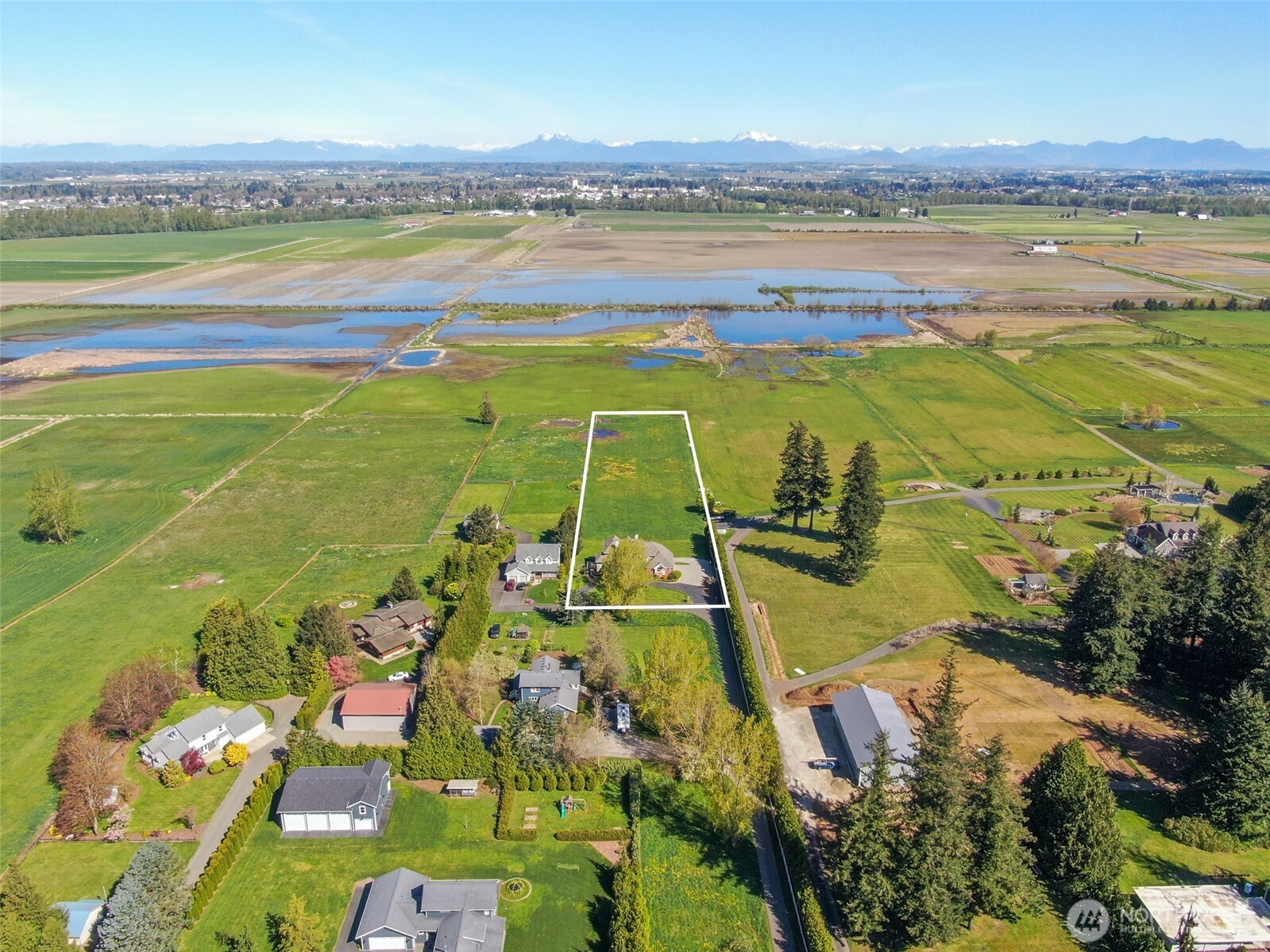 746 Van Dyk Road Lynden, WA 98264 - Photo 40 of 40 a view of a city with an ocean view