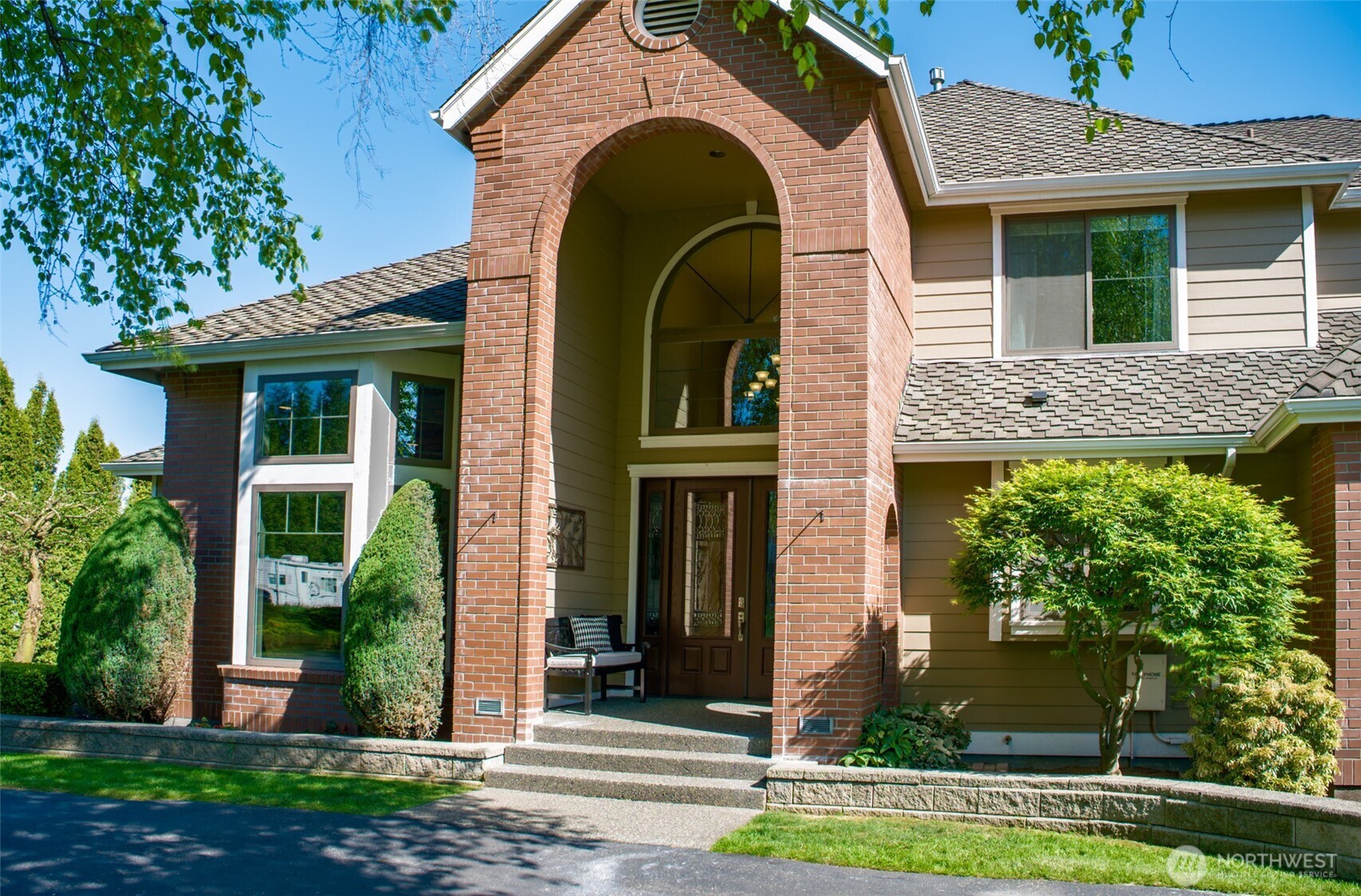 746 Van Dyk Road Lynden, WA 98264 - Photo 4 of 40 a view of a house with a small yard and plants