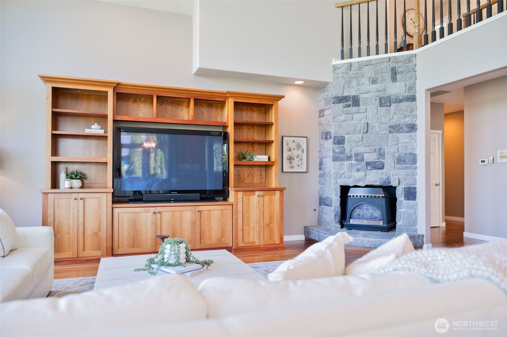 746 Van Dyk Road Lynden, WA 98264 - Photo 7 of 40 a bedroom with a bed and a fireplace