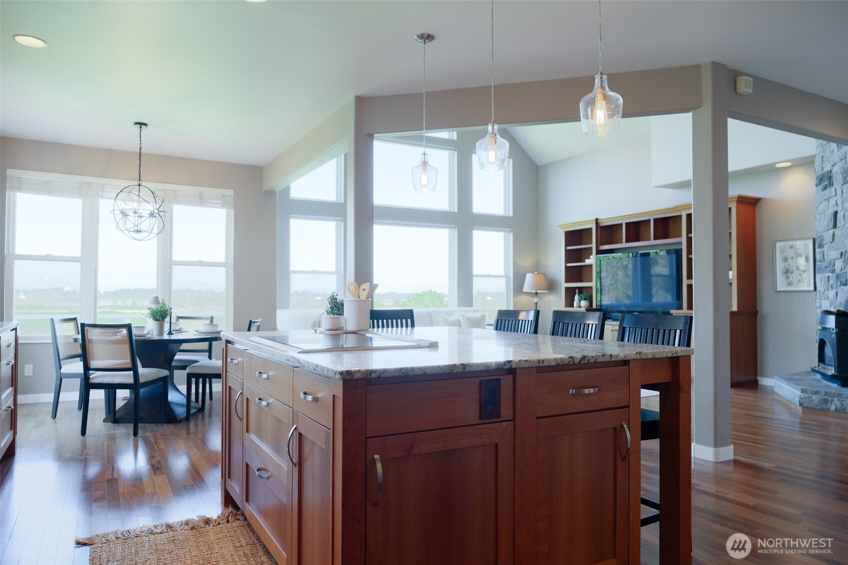 746 Van Dyk Road Lynden, WA 98264 - Photo 9 of 40 a kitchen with granite countertop lots of counter top space and dining table