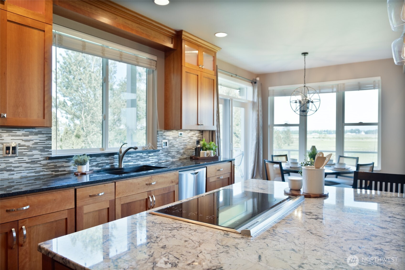 746 Van Dyk Road Lynden, WA 98264 - Photo 10 of 40 a kitchen with large windows and refrigerator